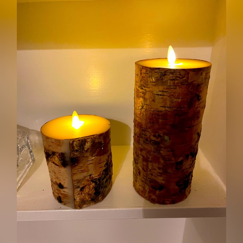 Luminary fake candles with wood trim ! 
Makes plenty of light and nice waxy feel